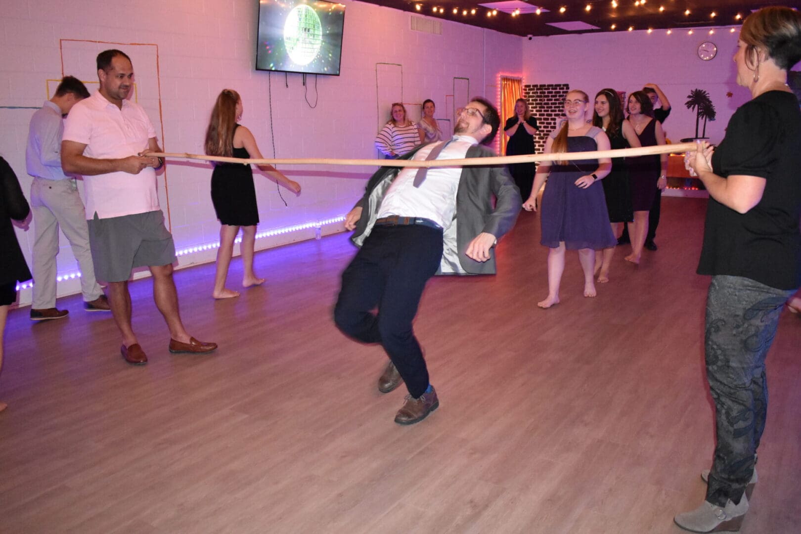 A man in a suit and tie is playing with a rope.