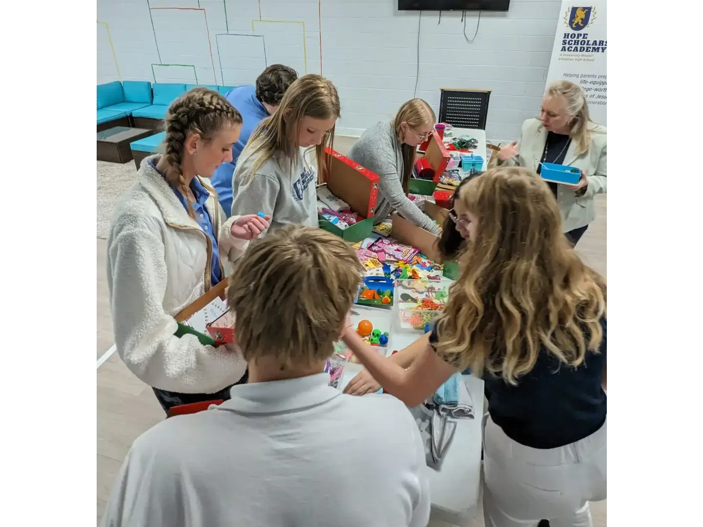 A group of people sitting around a table.